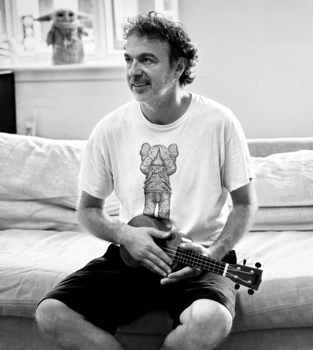 The author, Pablo Meyer Rojas, sitting on a sofa with a ukelele.